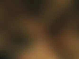 Film still from Obsession (2025). It shows Bear and Nikki at the party they went to. Nikki is kneeling next to Bear, waiting for a kiss.