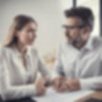 2 people having a consultation looking at the same form.jpg