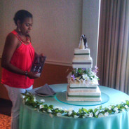 April sets up a wedding cake.