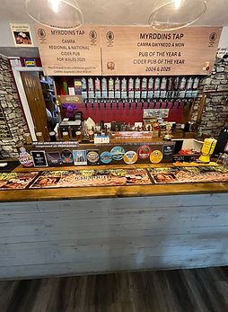 Bar serving award winning Welsh real ale and cider at Myrddin’s Tap Barmouth