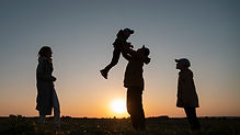 full-shot-family-silhouette-having-fun-sunset.jpg