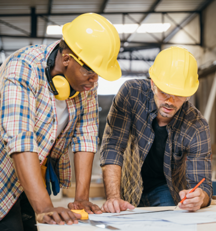 stock-photo-craftsmen-sketch-of-future-project-on-blueprint-paper-in-woodshop-carpenter-ma