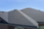 Roof of the house made of bitumen roof shingles aerial view.jpg