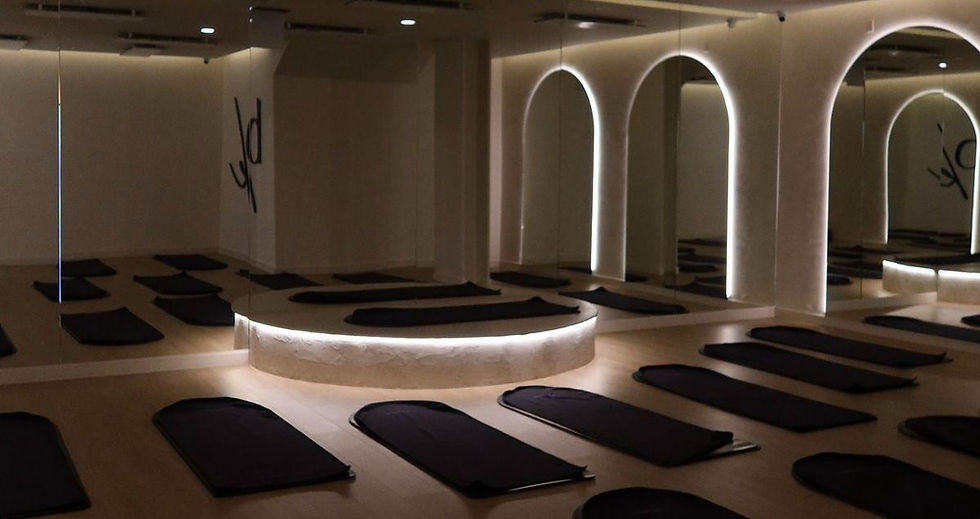 GROUND by Studio 34 branded mat laid out in the heated Pilates studio