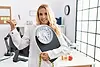 beautiful-blonde-nutritionist-woman-holding-weight-machine-balance-weight-loss-pointing-th
