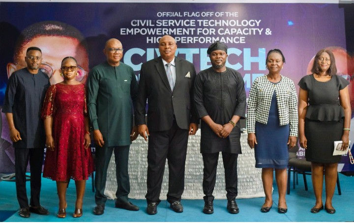 Group photograph of the Head of Service, Mr. Orok Okon (middle); representative of the DG, NITDA, Dr. Aristotle Onumo (third left); DG, CRS MEDA, Mr. Great Ogban; and other state government officials.