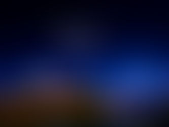 The village of Arandelle lit up at night with drones showing the message: World of Frozen, Opening March 29th 2026