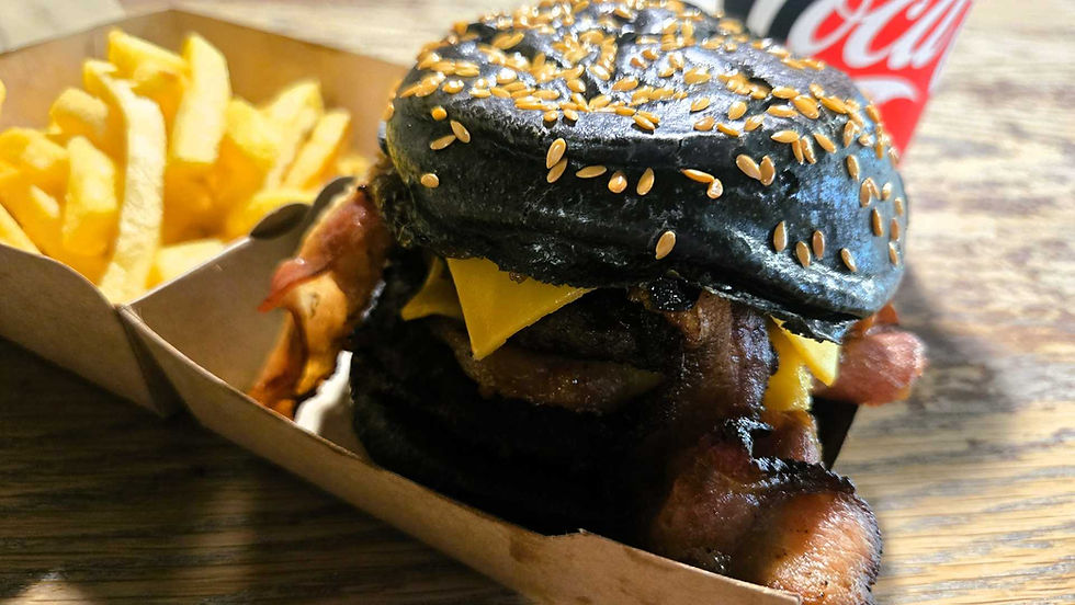 The Captain's Burger meal- two beef patties, bacon, cheese, caramelised onions, gherkins, chipotle mayo in a black sesame seed bun. Comes with fries