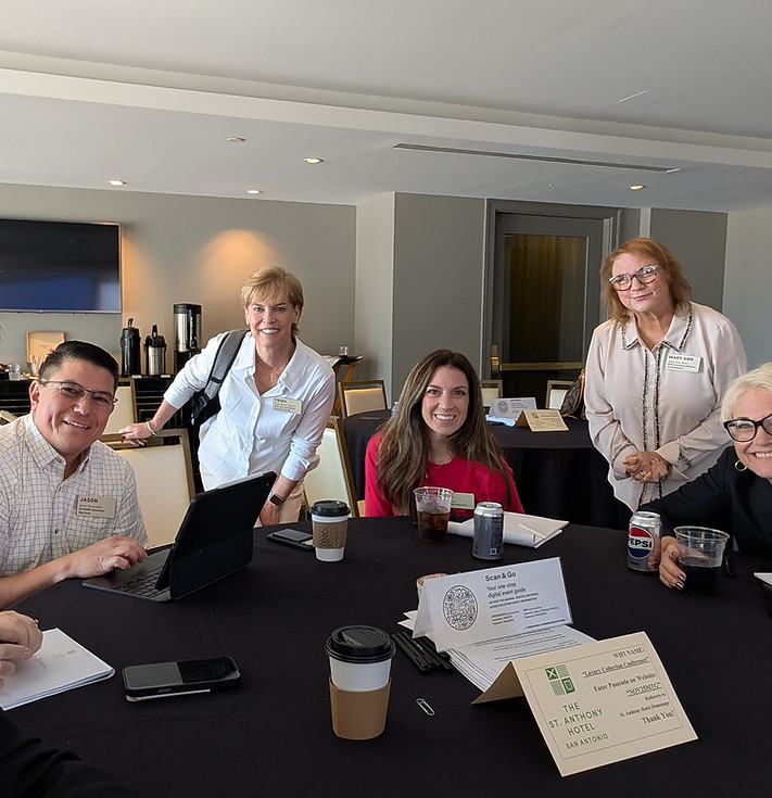 Small group of AI Leadership Strategy Day attendees collaborating and discussing strategic priorities