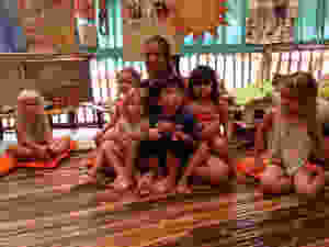 How many children can fit on Ibu Russlee's lap?