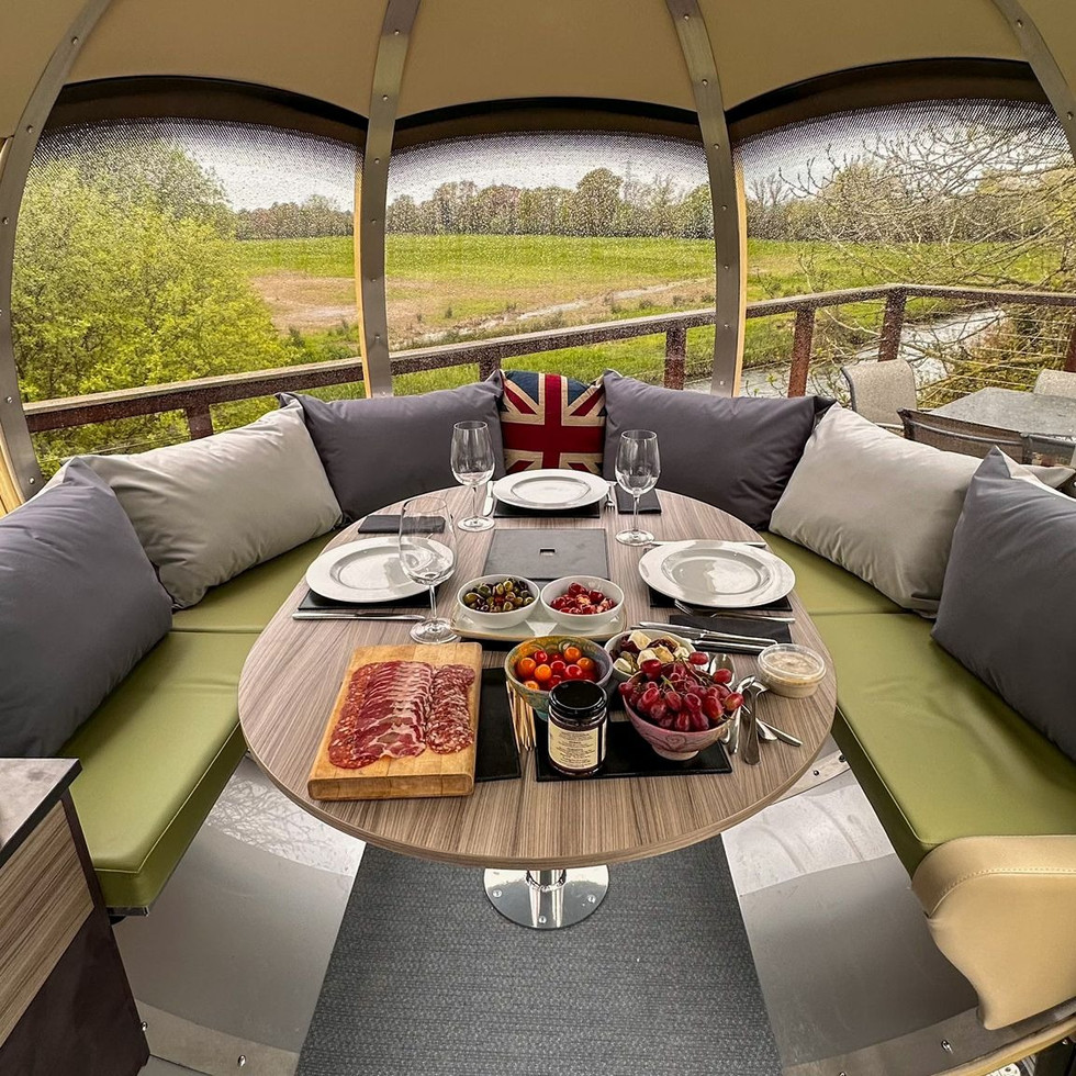 Dining inside the Large Oval House Ornate Garden Pod