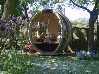 Rotating Lounger Ornate Garden Pod in shady garden