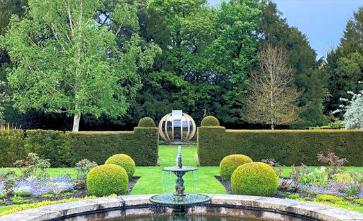 The Deluxe Ornate Garden Pod in manicured english country garden