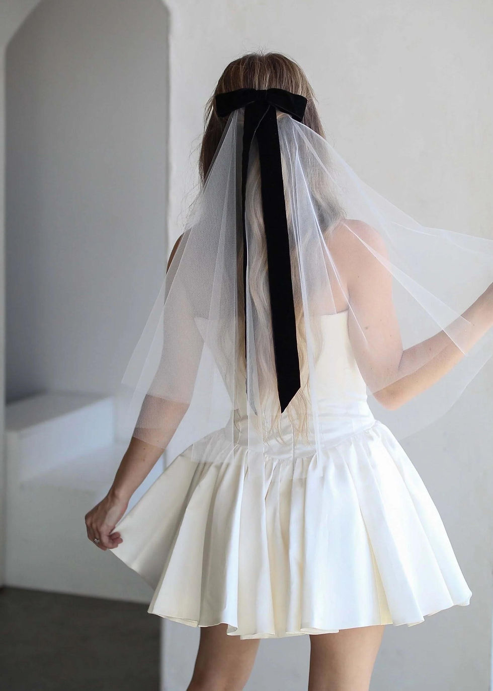 white veil with black velvet bow
