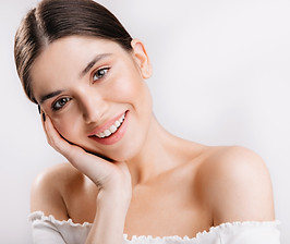 portrait-smiling-girl-with-healthy-skin-cute-dark-haired-woman-white-wall.jpg