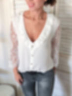 Blouse blanche à manches en dentelle