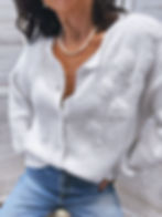 Gilet blanc en laine avec détails fleuris en relief