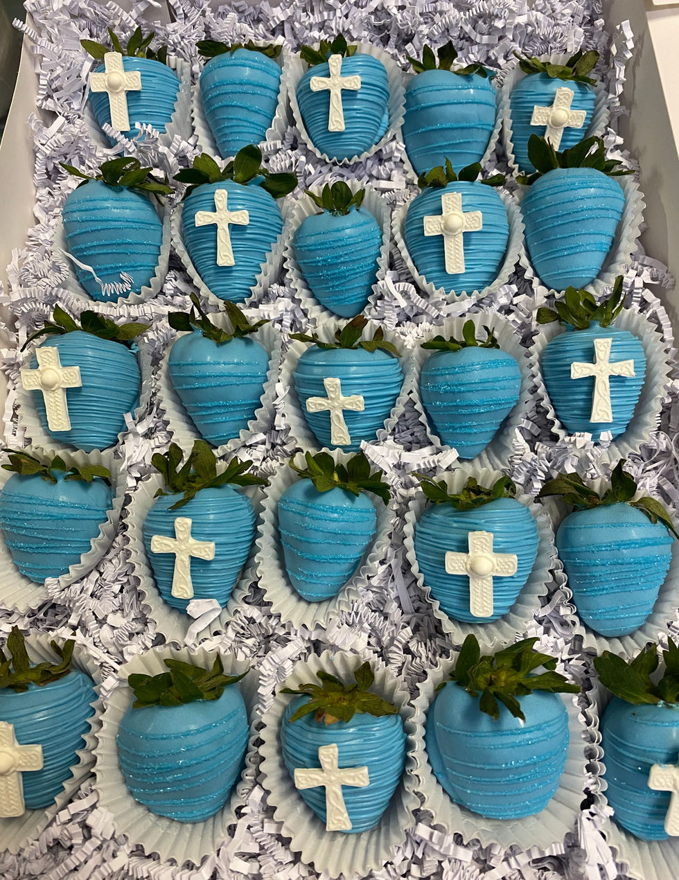 a box of blue chocolate covered strawberries with white crosses on them