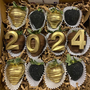 a box of chocolate covered strawberries with the year 2024 on them