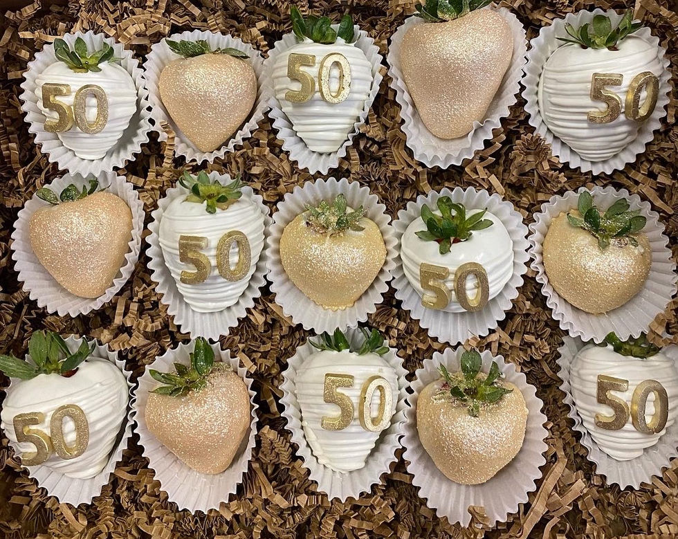 a bunch of chocolate covered strawberries with the number 50 on them