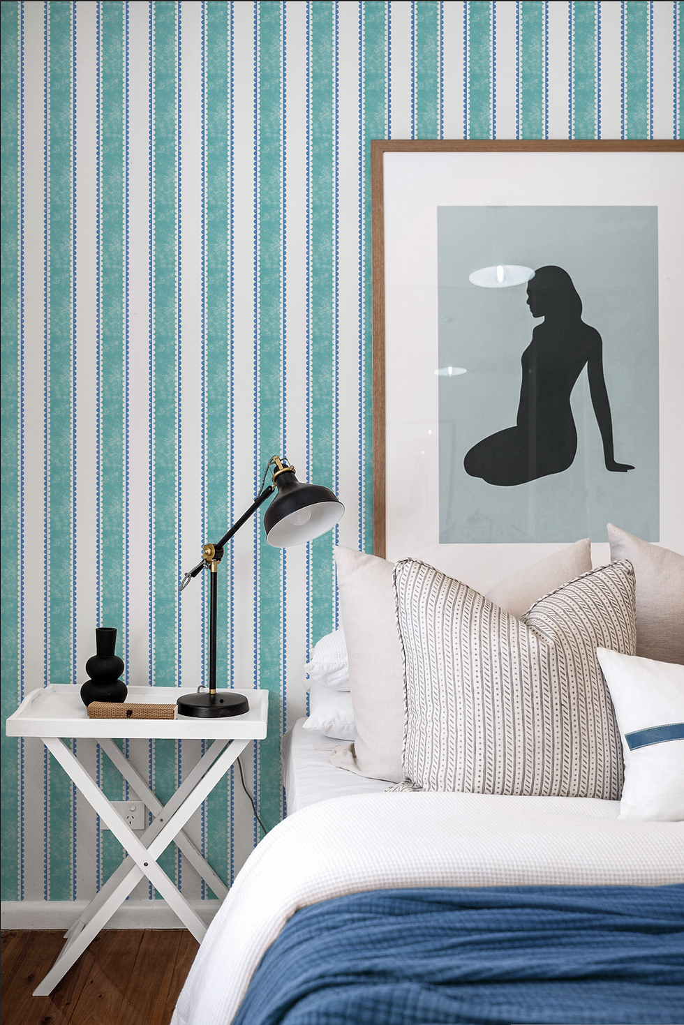 A turquoise and white striped wallpaper