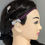 Thumbnail: Headband and cochlear implant on mannequin head. Vibrant Cochlear Implant Headband: Non-Slip, Adjustable.