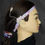 Thumbnail: Woman wearing hearing aid and headband. Michela Design Canada.