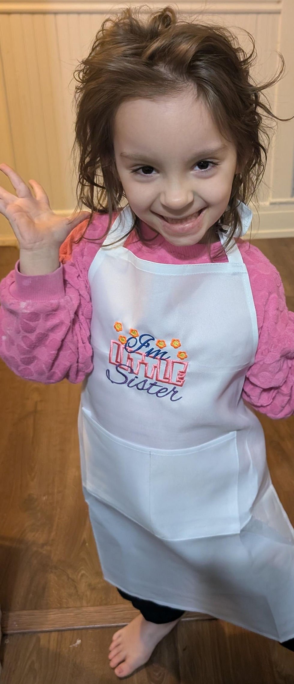 Little girl wearing apron
