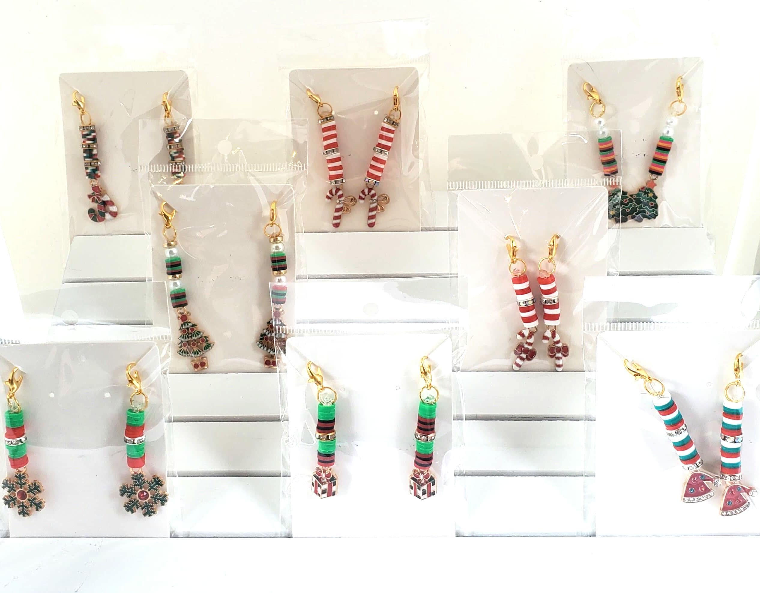 Array of various Christmas earrings on display, Michela Design Canada.