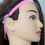 Thumbnail: Pink headband with hearing aid on mannequin head, Snowman Hearing Aid Charms, side view.
