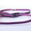 Thumbnail: Close-up of a purple glittery headband with a black clasp on white background.