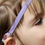 Thumbnail: Young girl with Baha headband, detail shot, hearing aid assistance device.