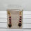 Thumbnail: Earrings in a package with red, white, black beads and gold accents Michela Design Canada
