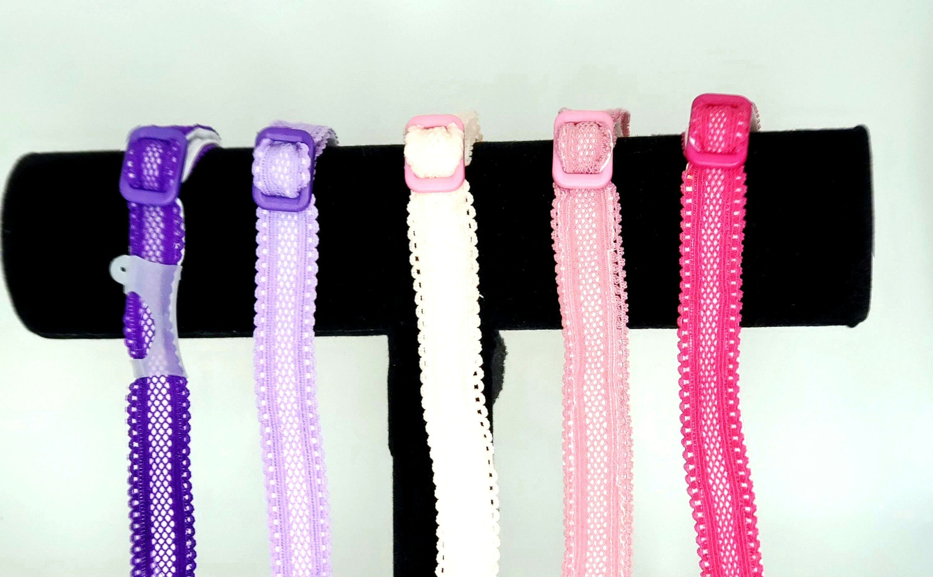 Five colorful headbands displayed against a black background, Michela Design Canada.