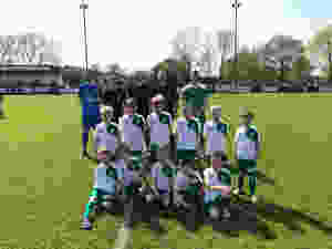 Street U8's were mascots for the day enjoying the sunshine and a half time penalty shoot out.