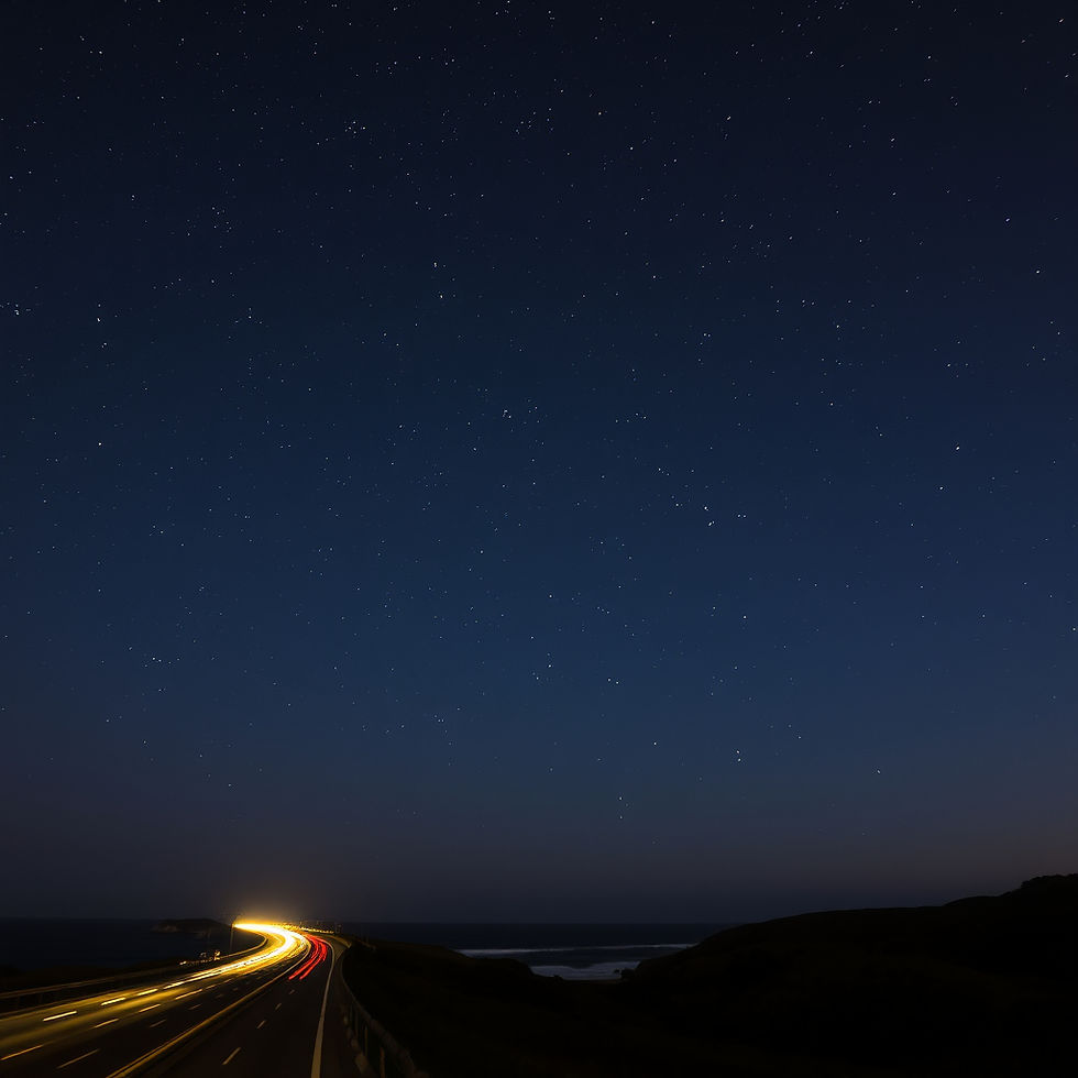 Night sky with visible constellations over a coastal highway, representing the Sky School astrology and mythology series