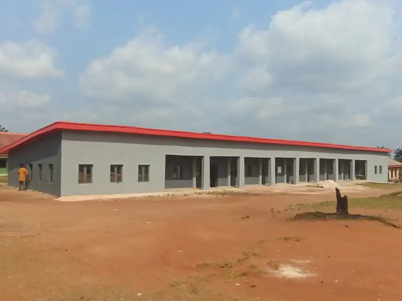 The front of the new block with its red roof