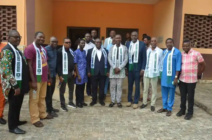 Old students in EGSOSA sashes gathered outside a school building