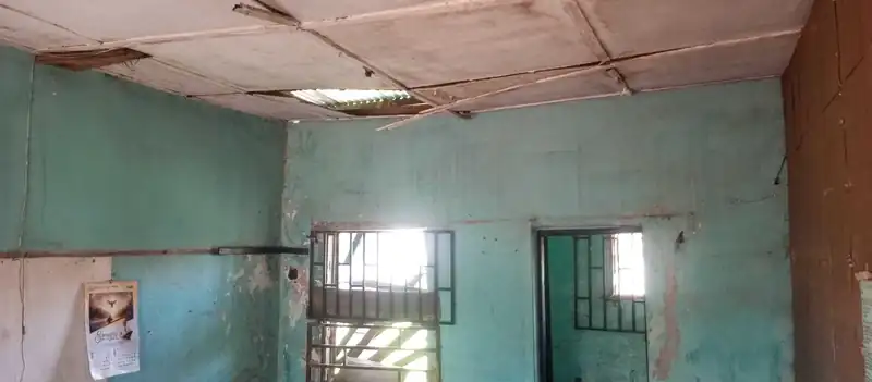 A classroom in the old block with its ceiling gone