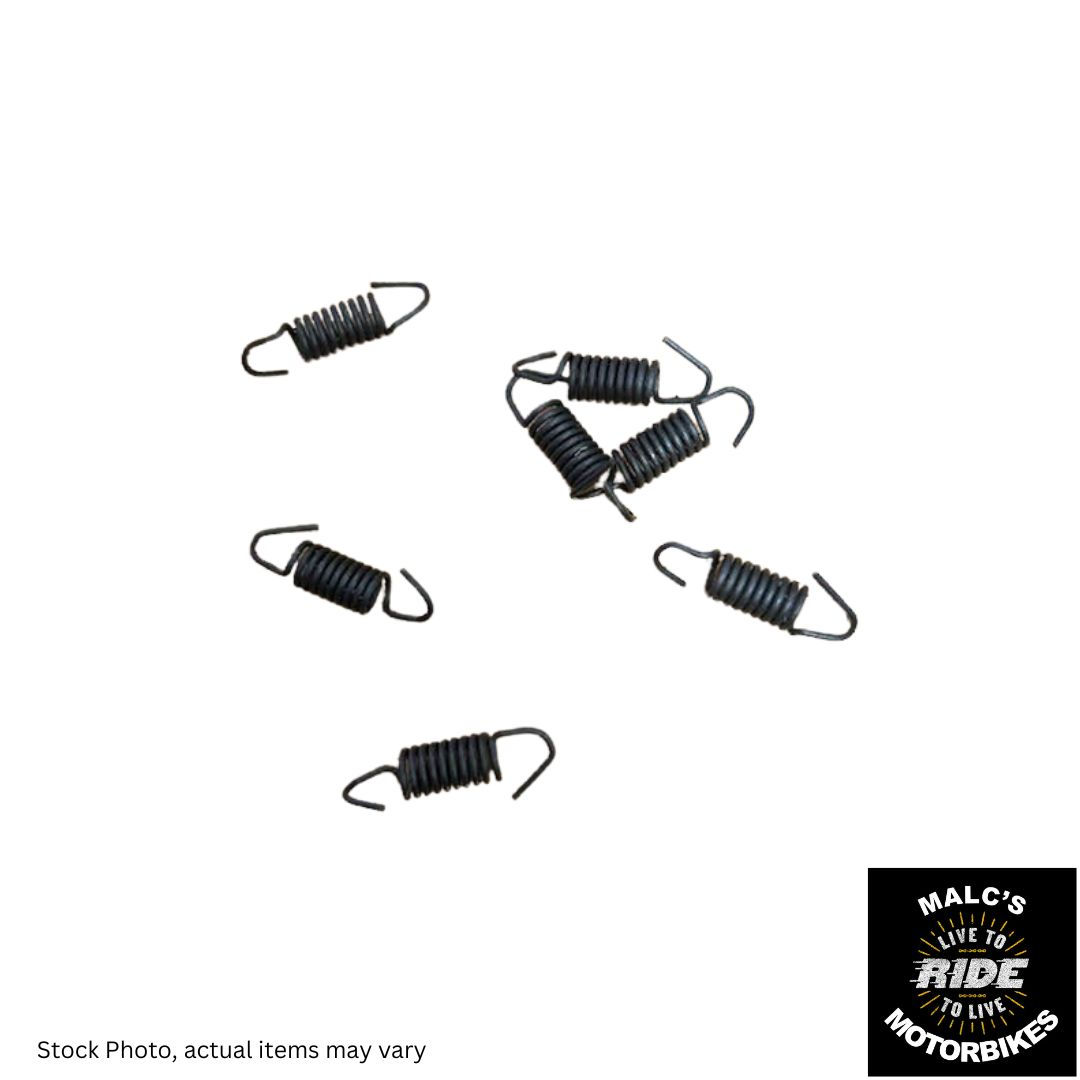 Several black springs scattered on a white background Malc's Motorbike Spares