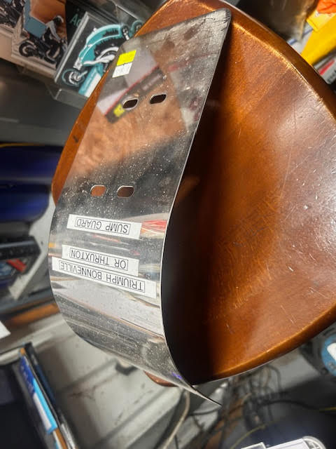 Front seat of motorcycle parts, including visible text. Malcsmotorbikespares.