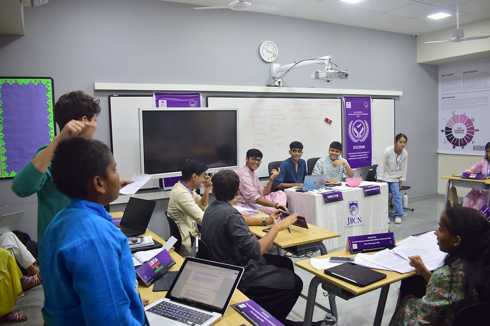 Picture from JBCN Oshiwara MUN of delegates arguing and others having fun and laughing