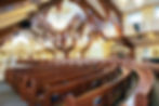The inside of a churchwith pews