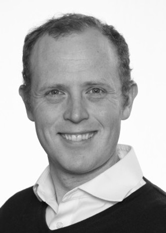 A headshot of a previous executive client