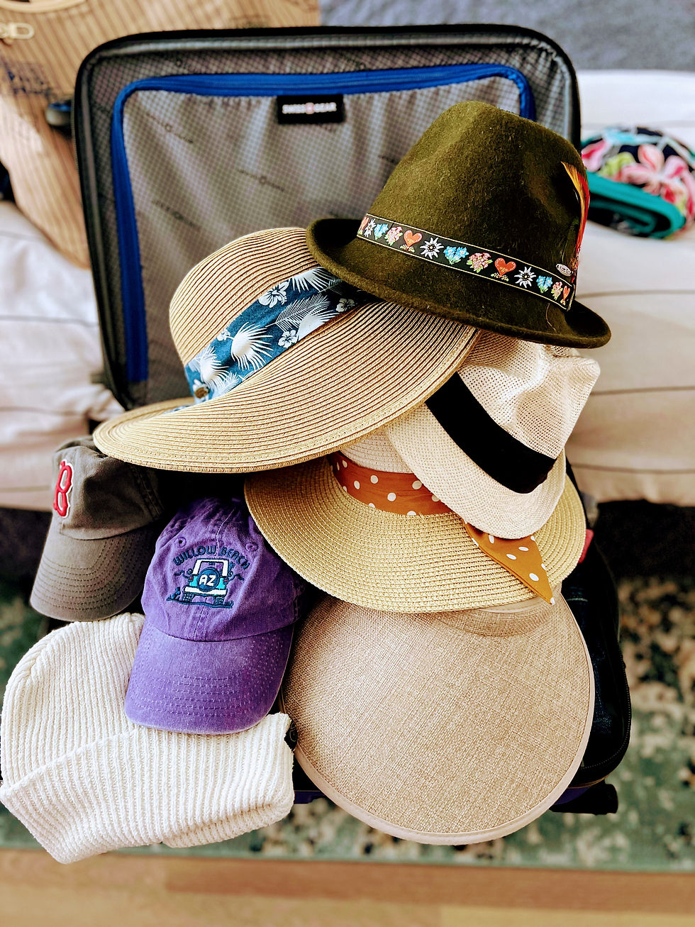 So many hats I've bought while on vacation!