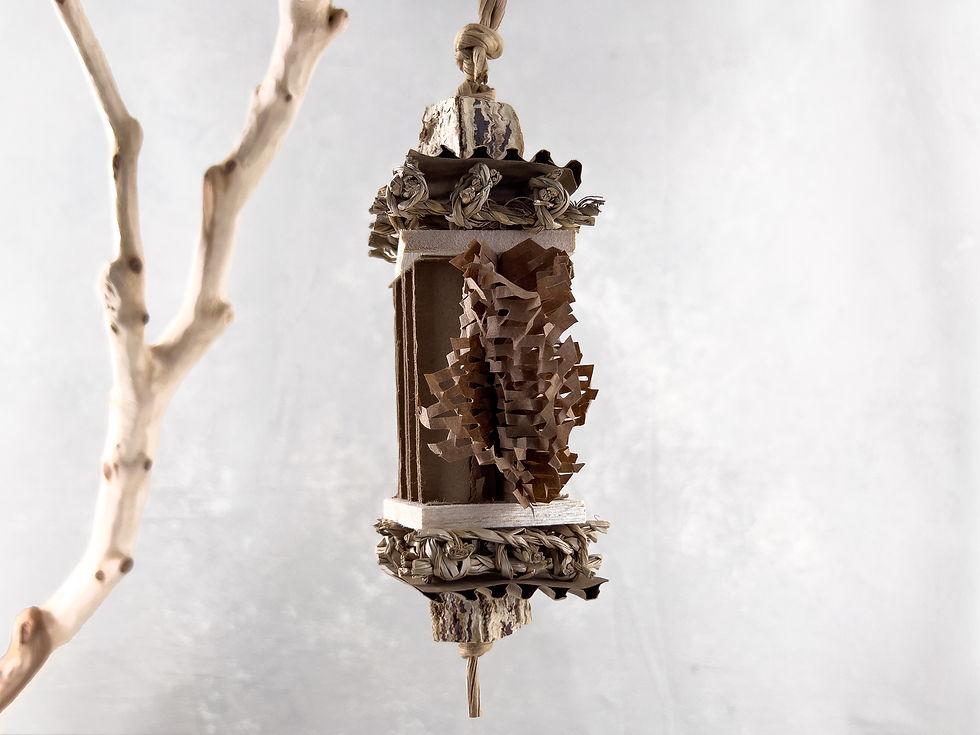 Small bird toy for foraging and shredding, made of seagrass mat, mahogany pod, cardboard paper, shredded paper, paper rope.