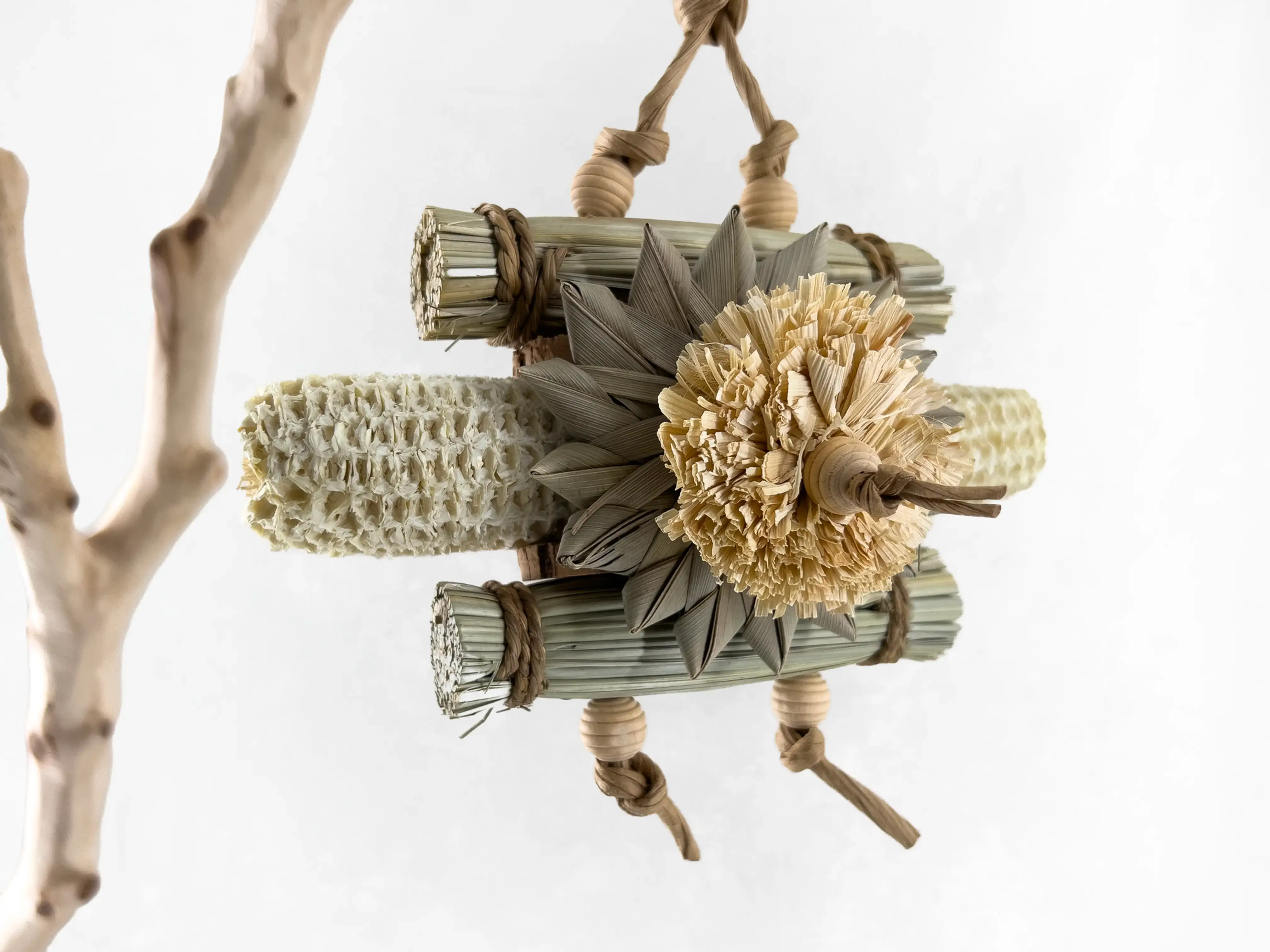 Natural seagrass bird toy with corn cob and palm for small to medium parrot shredding and enrichment.