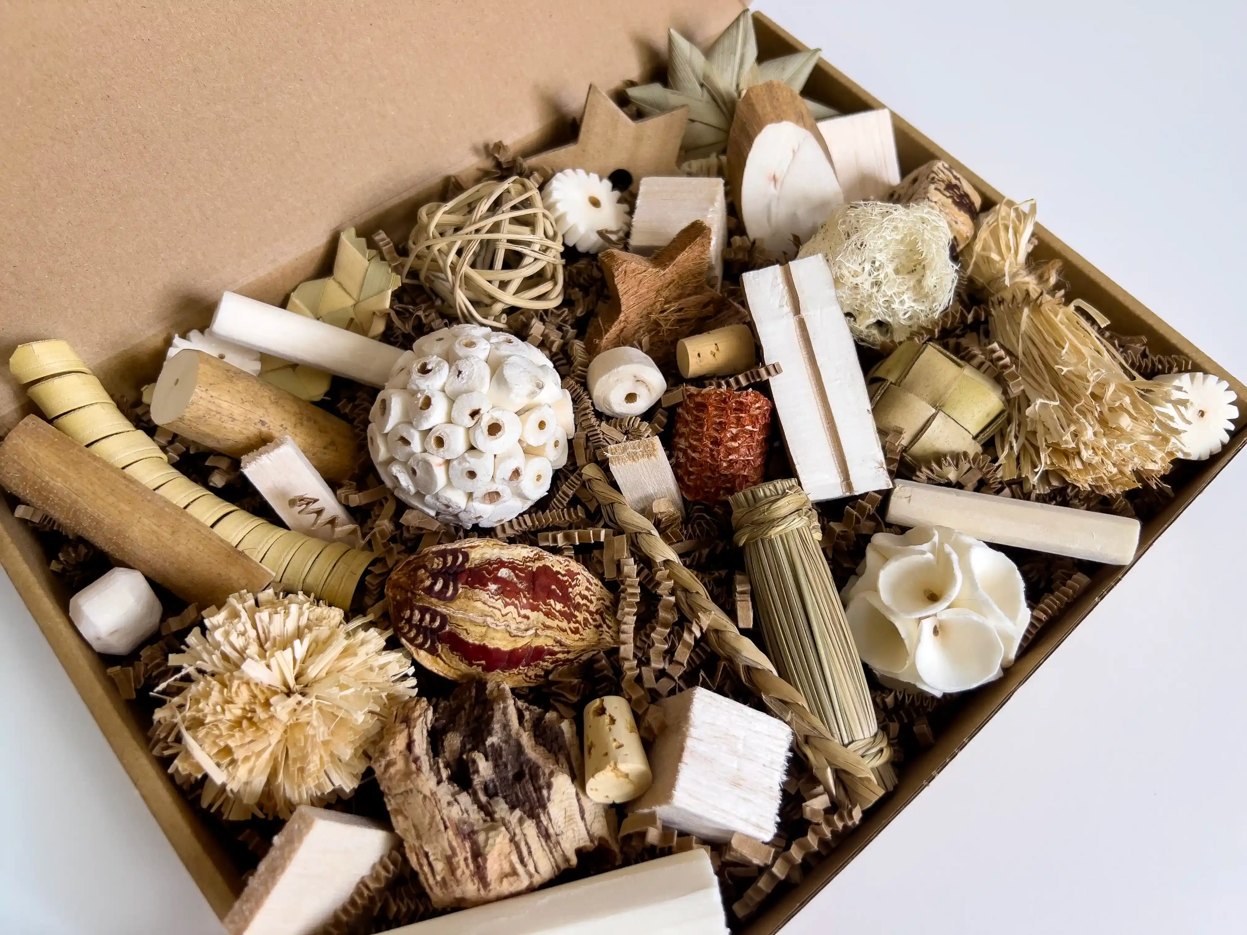 40pc small bird foraging fun box with natural sola wood, balsa, and crinkle paper shredder toys for parakeets and canaries.