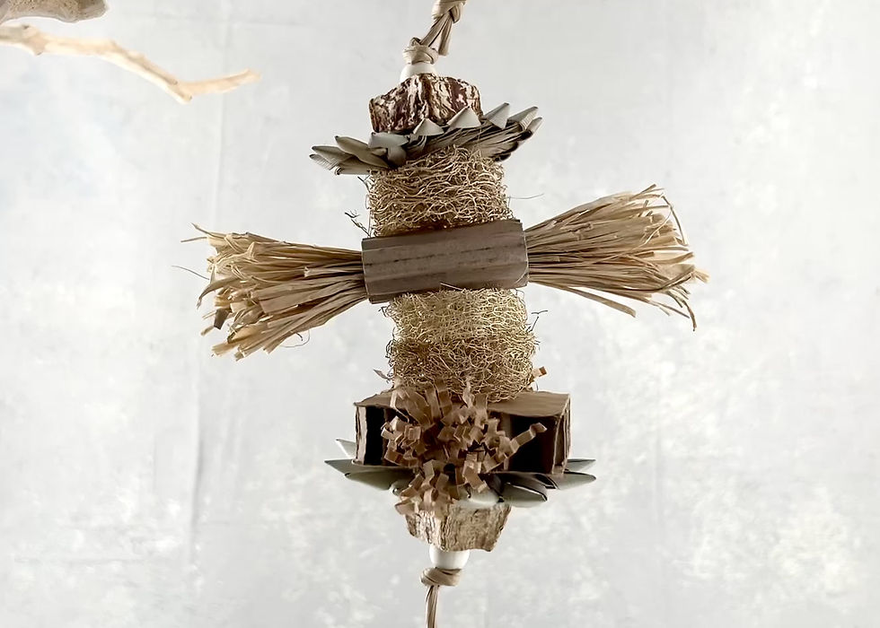 Handcrafted dye-free bird chew toy with shredded paper and natural loofah for cockatiels and conures.