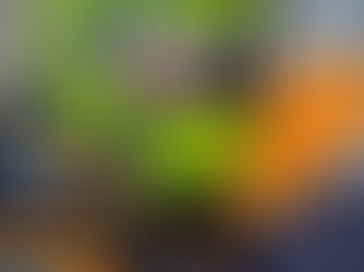 Close-up of McLaren F1 driver Lando Norris wearing his bright yellow race helmet with Android branding during a race weekend.